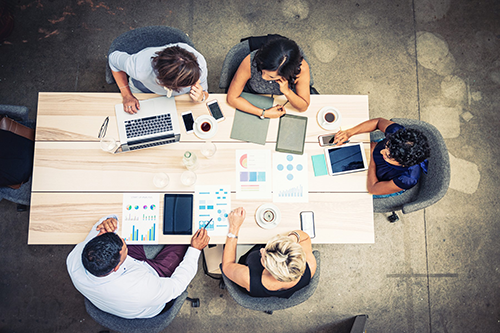 Finance professionals meeting at a table