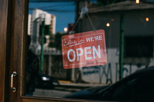 Open sign on small business door