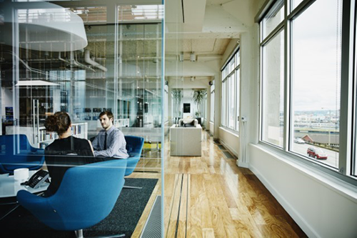Man and woman in an office meeting