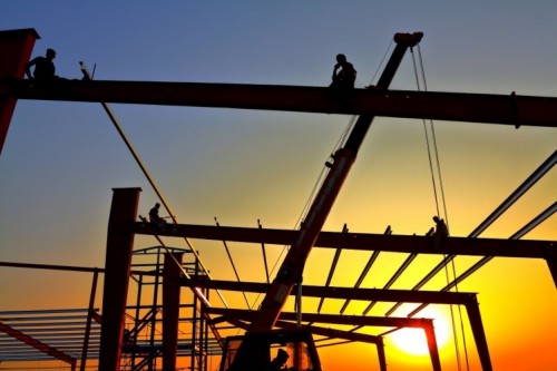 Construction site with workers in background